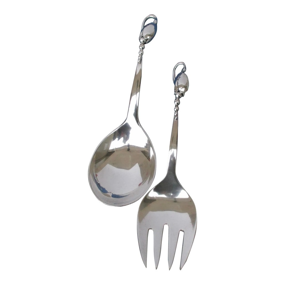 Georg Jensen "Blossom" Serving Set Circa 1930s. - Set of 2: Georg Jensen pattern "Blossom" by Christian Heise. Organic pattern of lily of the valley motif. Mid-century medium-sized set. The size is 8.5" long and 8' long. Beautiful art deco design. The