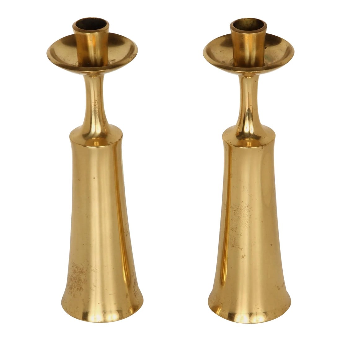 1950s Jens Quistgaard Brass Candlesticks for Dansk - a Pair: 1950s Jens Quistgaard Brass Candlesticks for Dansk - a Pair. One of his most noteworthy and iconic designs. Quintessentially Danish modern in its execution and inherent aesthetics. Dansk was one of