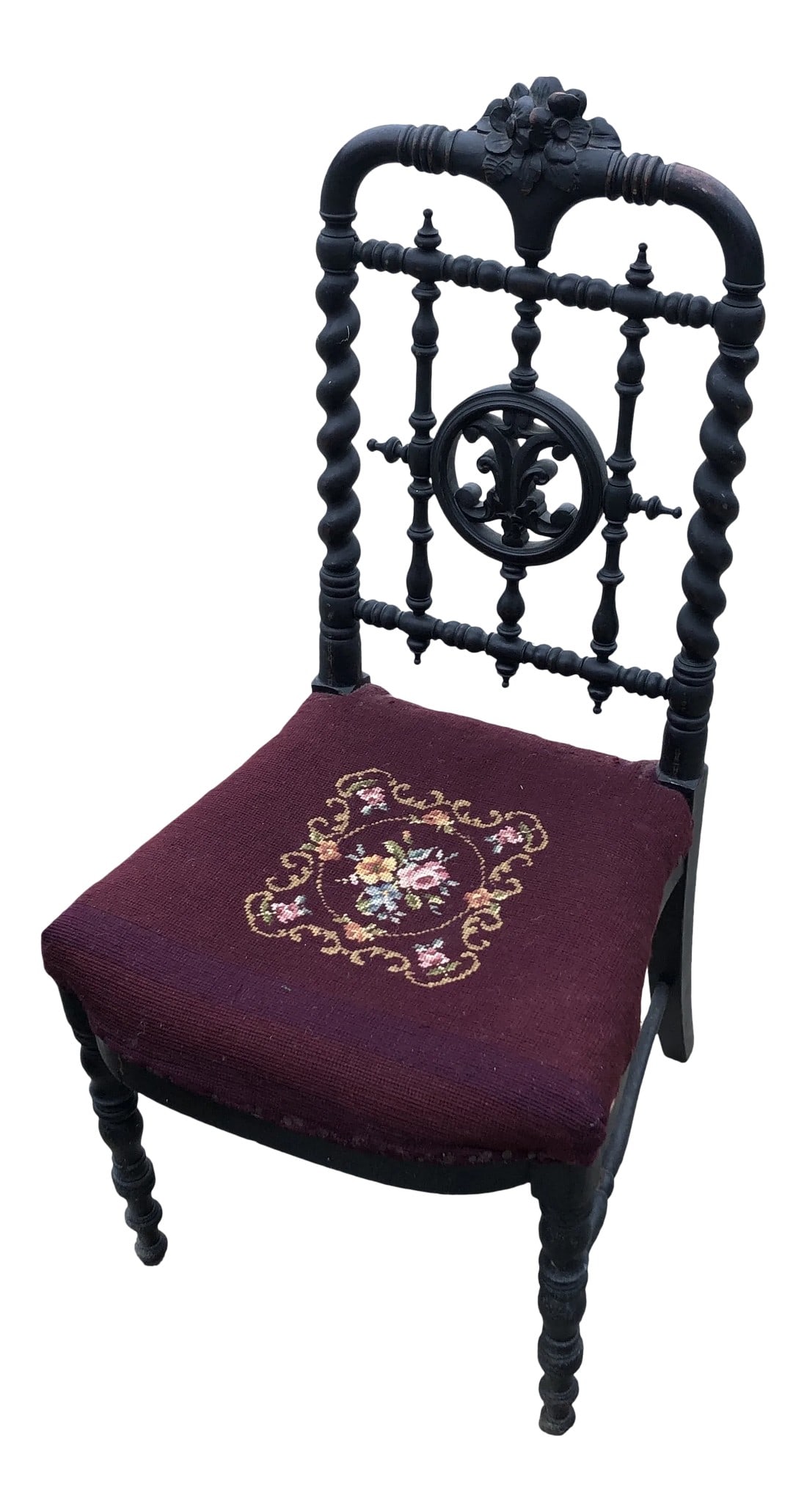 Antique Hand Embroidered Chair: Beautiful hand carved antique chair with intricate details. There is one spindle on the bottom that is missing, but nothing that takes away from the integrity of the chair. 16" floor to seat