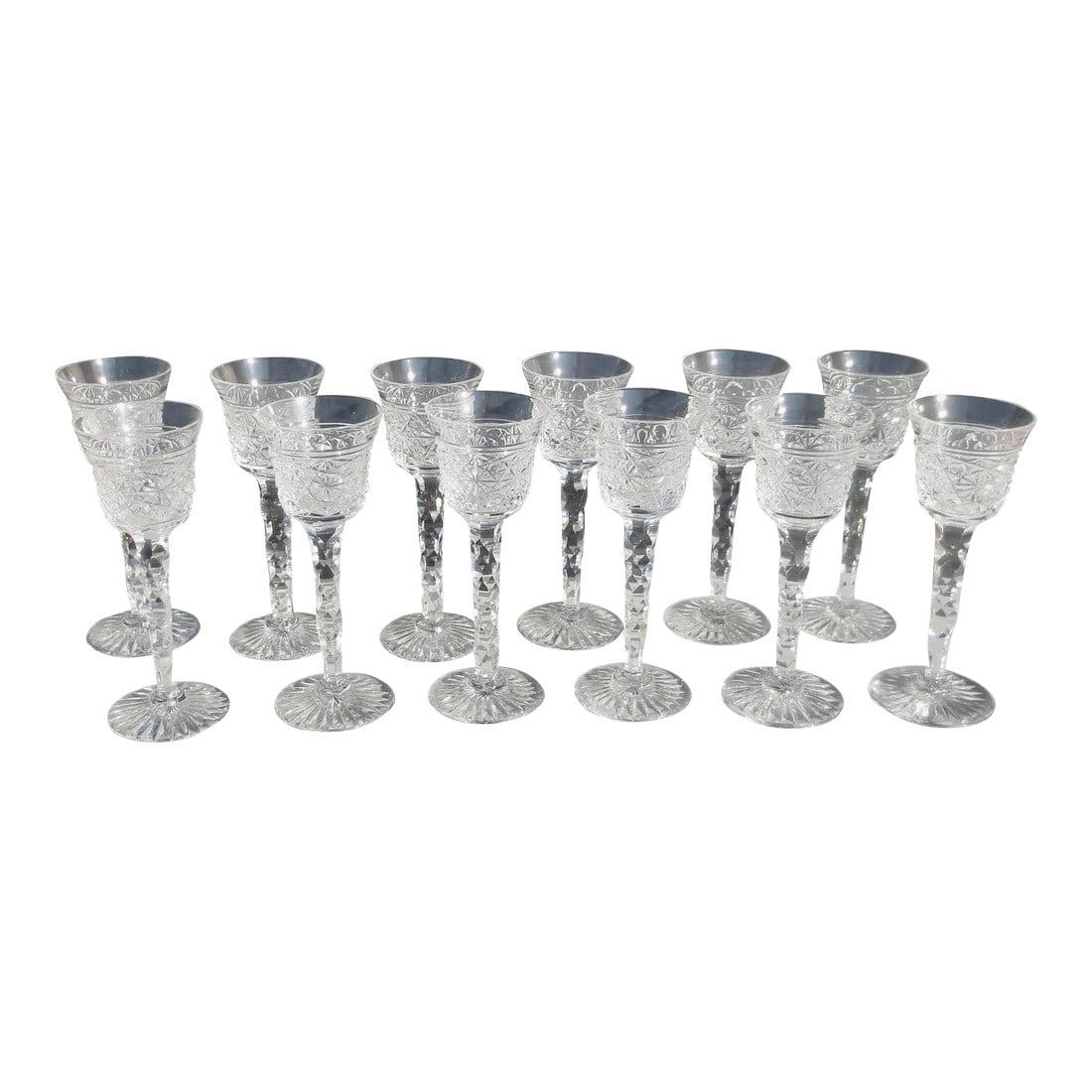 12 Cordials by Royal Leedam Romance - Set of 12: Romance by Royal Leerdam Netherlands. circa 70s' A set of 12 excellent cordials. Honeycomb cut stem pattern, a revival of an 18th-century pattern. A geometric cut with a star base. Excellent