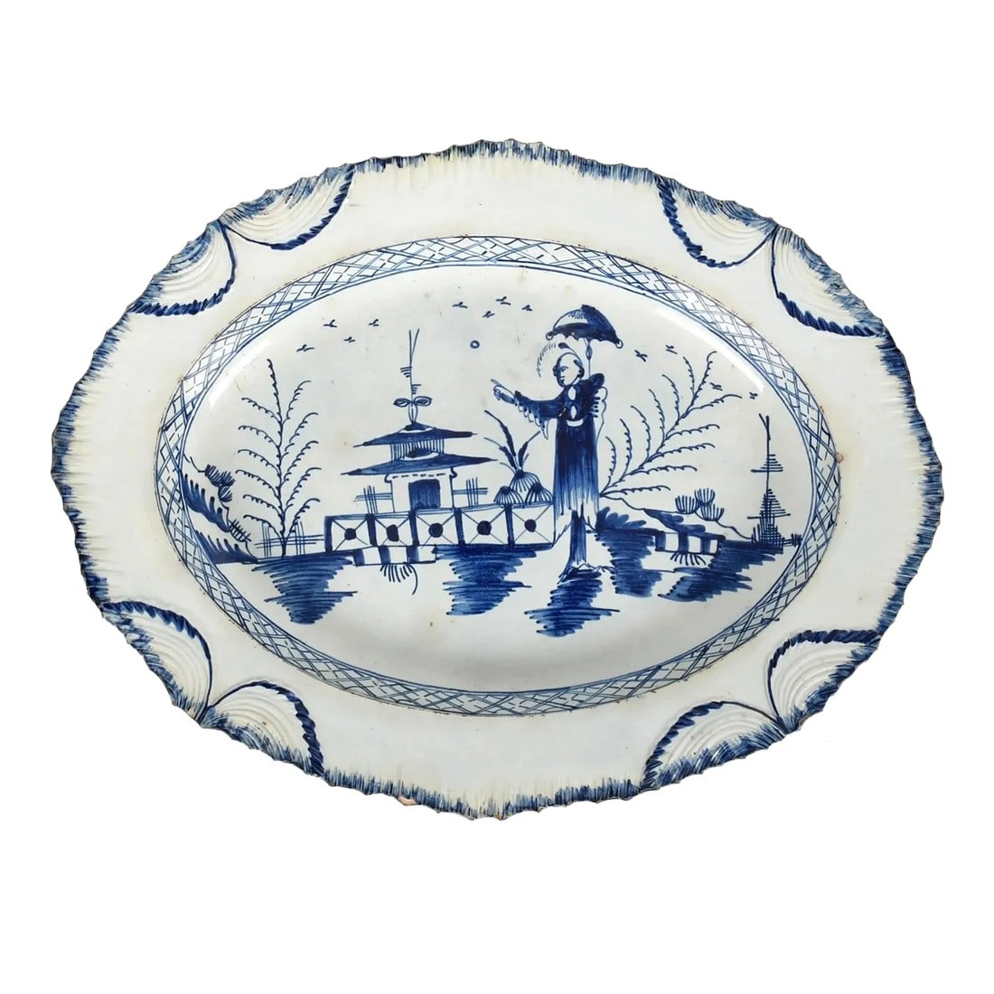 Pottery Shell Edge Pearlware Oval Dish With Chinoiserie Decoration: Large English Pearlware Oval Dish with Blue and White Chinoiserie and Shell Edge This striking large oval dish, dating from circa 1790, is an excellent example of late 18th-century English pottery, po