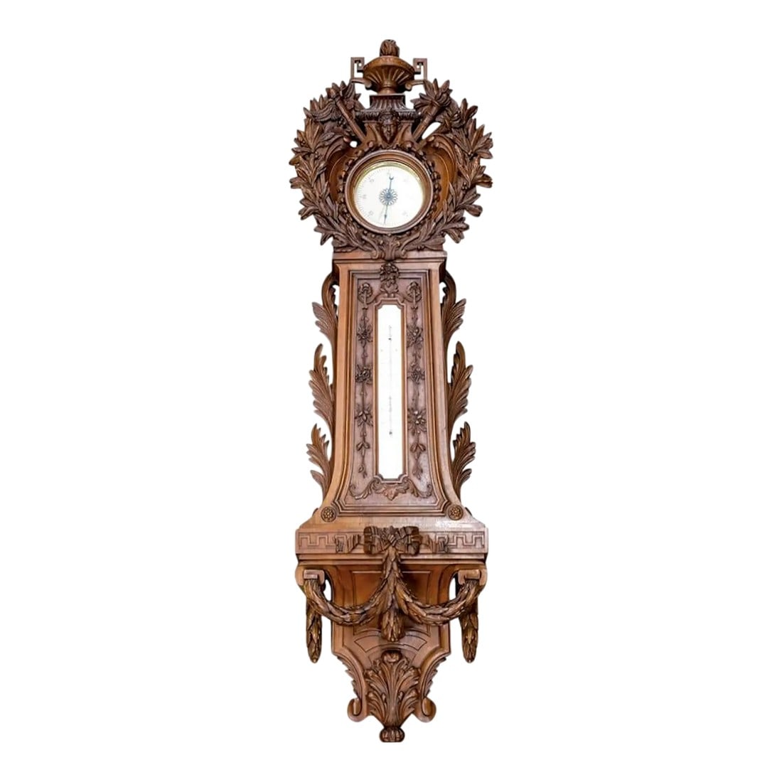 Monumental European Carved Wood Barometer and Thermometer: Large 19th Century Black Forest Thermometer Barometer combo featuring mounted in a wooden case, intricately hand-carved with a crowned face above the barometer, and beneath a buttress supporting a fla