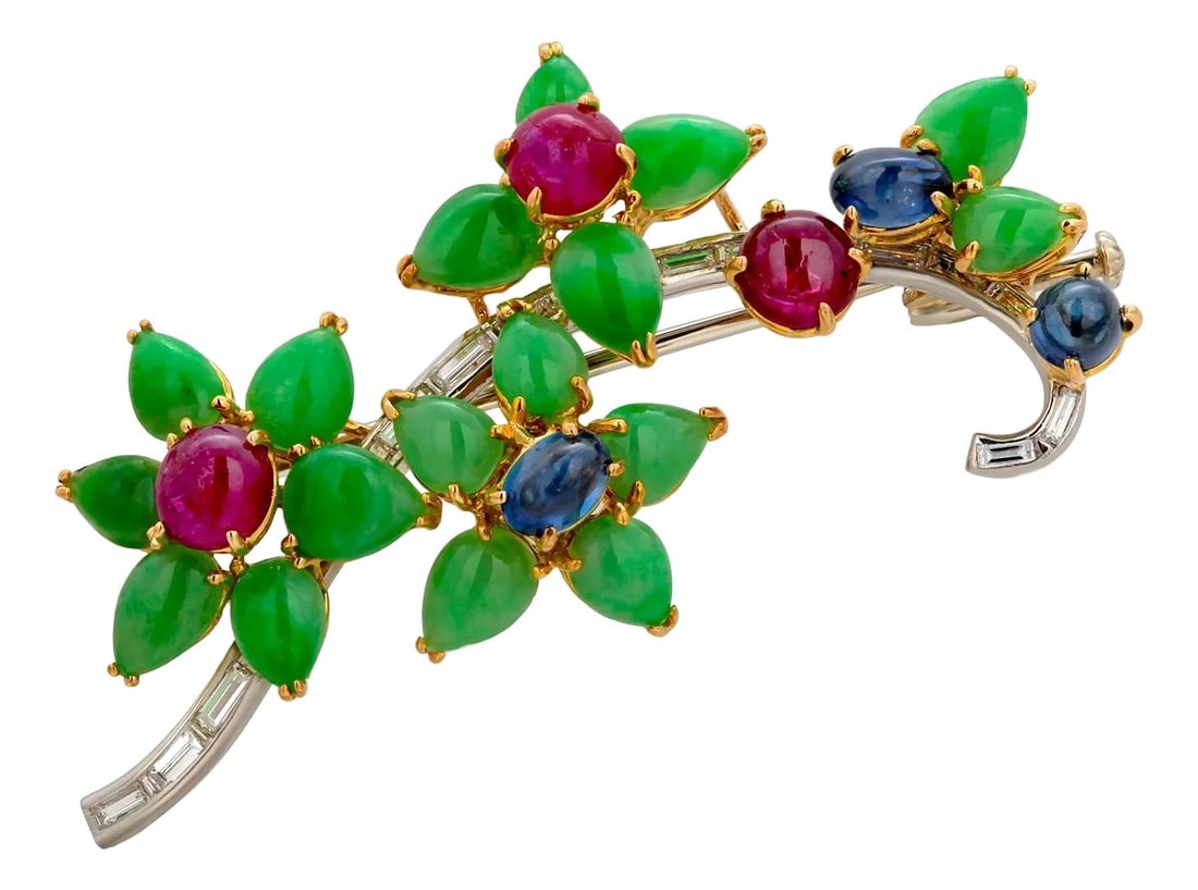 1970s Rare Antique Platinum Floral Brooch Baguette Diamonds Jade Rubies and Sapphires: A Masterpiece of Timeless Elegance and Exquisite Craftsmanship Experience the allure of this rare antique floral brooch, a stunning embodiment of luxury and artistry. Meticulously crafted from