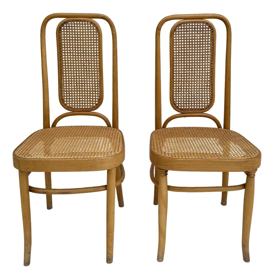 Pair of Cane and Bentwood Thonet-Style Chairs: Here is a beautiful pair of matching bentwood and cane chairs inspired by the designs of Thonet. The chairs feature blonde solid wood bases with amazing rounded edges and circular shapes. There is