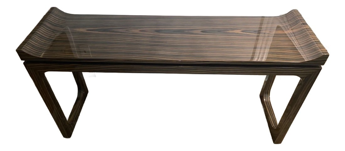 Art Deco Macassar Veneer Lacquered Console: Eye catching sleek lacquered art deco style console having gorgeously grained Macassar veneer. Each end curves sensually upward and the legs at each end are connected to oneanother by a stretcher. Con