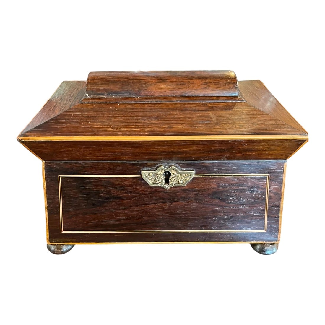 Regency Pagoda Top Sarcophagus Tea Caddy: A striking example of late regency inspired design, this English tea caddy circa 1900 features a dramatic pagoda form lid, atop a classic sarcophagus silhouette. Crafted in rich wood with beautifully