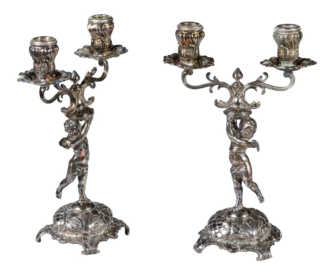 German Late 19th Century Jugendstil Silver Plated WMF Cherub Candelabras - A Pair: A pair of German Jugendstil late 19th century silver plated candelabras from the Wurtemberg Metalware Factory, with cherubs holding the bobèches. Born in Germany in the WÃ¼rttembergisch
