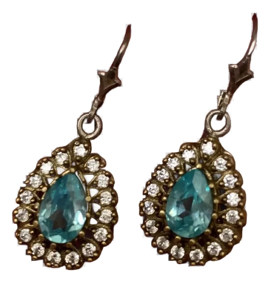 1940s Pair of Teardrop Blue Topaz Earrings: Blue & white topaz earrings in sterling silver with french back. Gold vermeil over sterling on the body of the earring. Circa 1940s, amazing sparkle, hang 1 3/4" from top to bottom. Thank you for shop