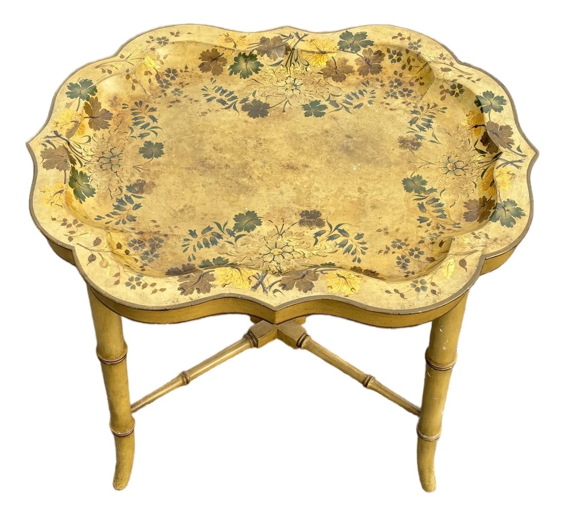 Mid 20th C. Hand Painted Mustard Yellow Tole Serving Tray on Fitted Faux Bamboo X Base Stand: French yellow and floral mid 20th C. tray table. Heavy carved and detailed wooden "x" frame with a painted enamel finish metal tray top. Base is designed to custom fit the top, and presents bamboo / c
