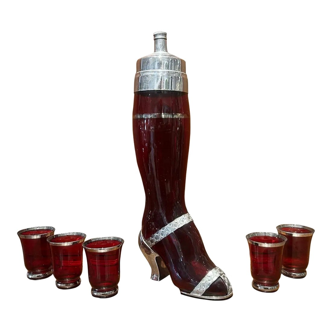Rare 1937 "Shake a Leg" Ruby Glass Cocktail Shaker and Original 5 Glasses: Rare "shake a leg" ruby glass cocktail shaker and original matching glasses made in 1937 by the West Virginia specialty glass company. The silver plated mounts were made in Connecticut for these