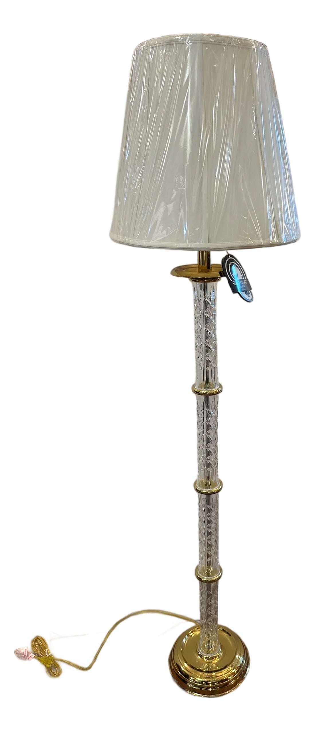 Waterford Crystal Floor Lamp With Brass Details: Classically beautiful never used Waterford crystal floor lamp with new shade and brass details. Shipped from Ireland year 2000 Never used No pitting Excellent condition 62" H floor to finial Joyce