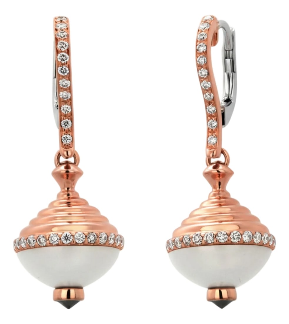 18k Rose and White Gold Enamel Diamond Orb Drop Earrings, 0.70 Carats, A Pair: A striking balance of modern artistry and timeless luxury, these orb drop earrings are meticulously crafted in 18K rose and white gold. Featuring a polished white enamel orb accented with brilliant