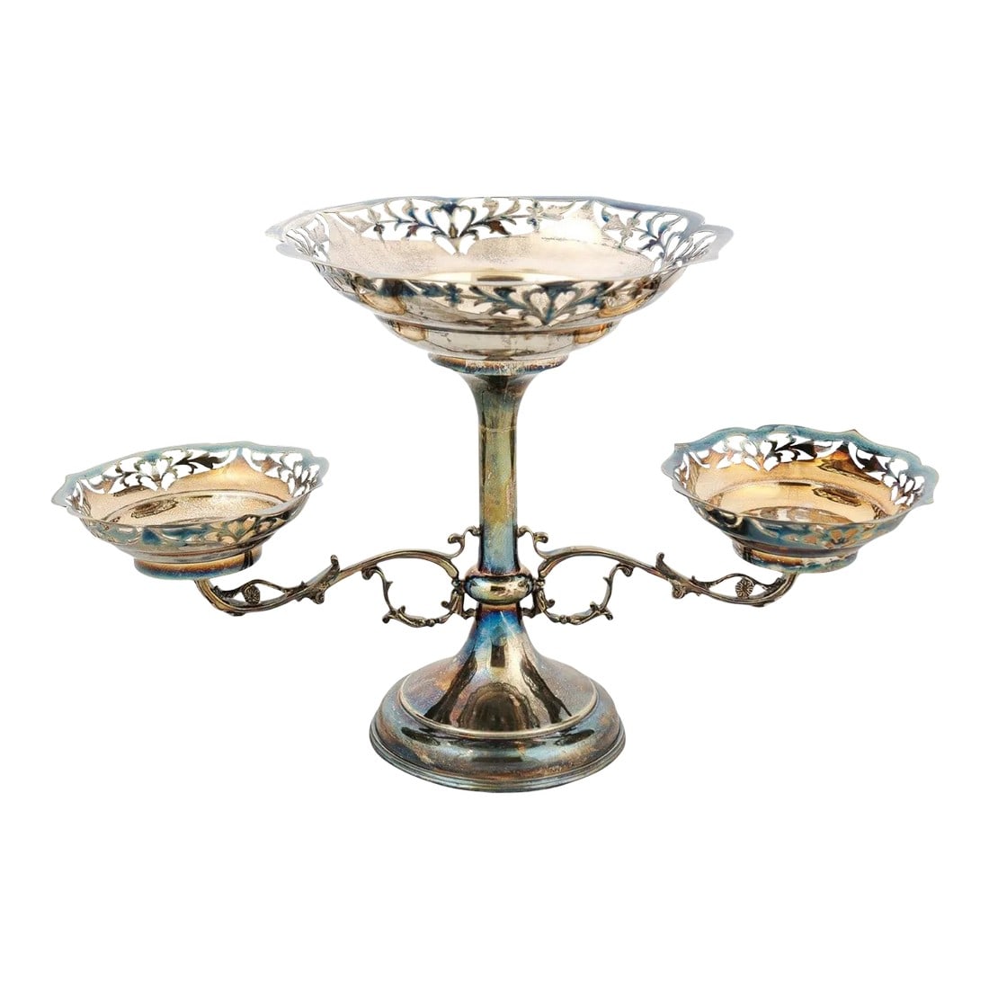 French 19th Century Silver Epergne with Pierced Foliage and Scrolling Motifs: A French silver epergne from the 19th century, with pierced silver bowls and foliage motifs. Created in France during the 19th century, this silver epergne features a central shaft supporting the