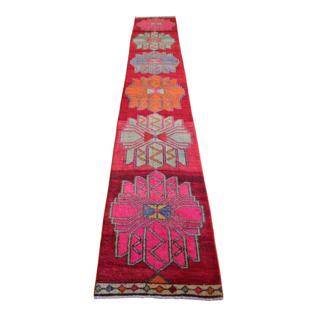 1970s Colorful Hand-Knotted Distressed Turkish Runner: Crafted by Anatolian artisans, this vintage hand-knotted runner brings authentic Turkish workmanship and a strong architectural rhythm to long, narrow spaces. Handwoven in Turkey for lasting daily