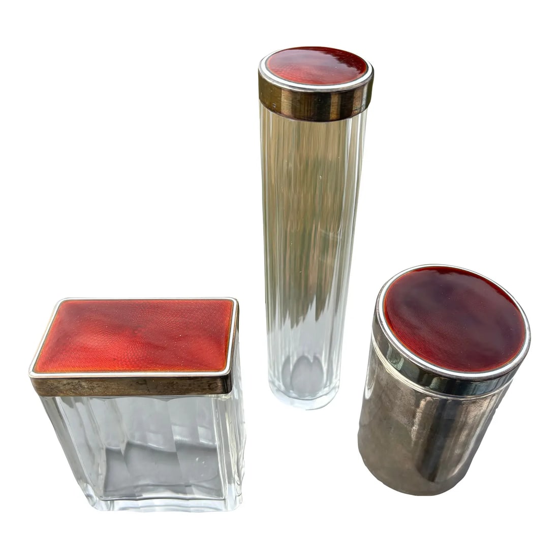 19th C. Red Guilloche Enamel, Sterling and Crystal Vessels - Set of Three: A Truly Beautiful Trio. Exceptional 19th C. Enamel, Sterling silver and crystal Vanity Set. Set of three fragrance / powder / oil bottles in faceted crystal, with the most remarkable enamel on