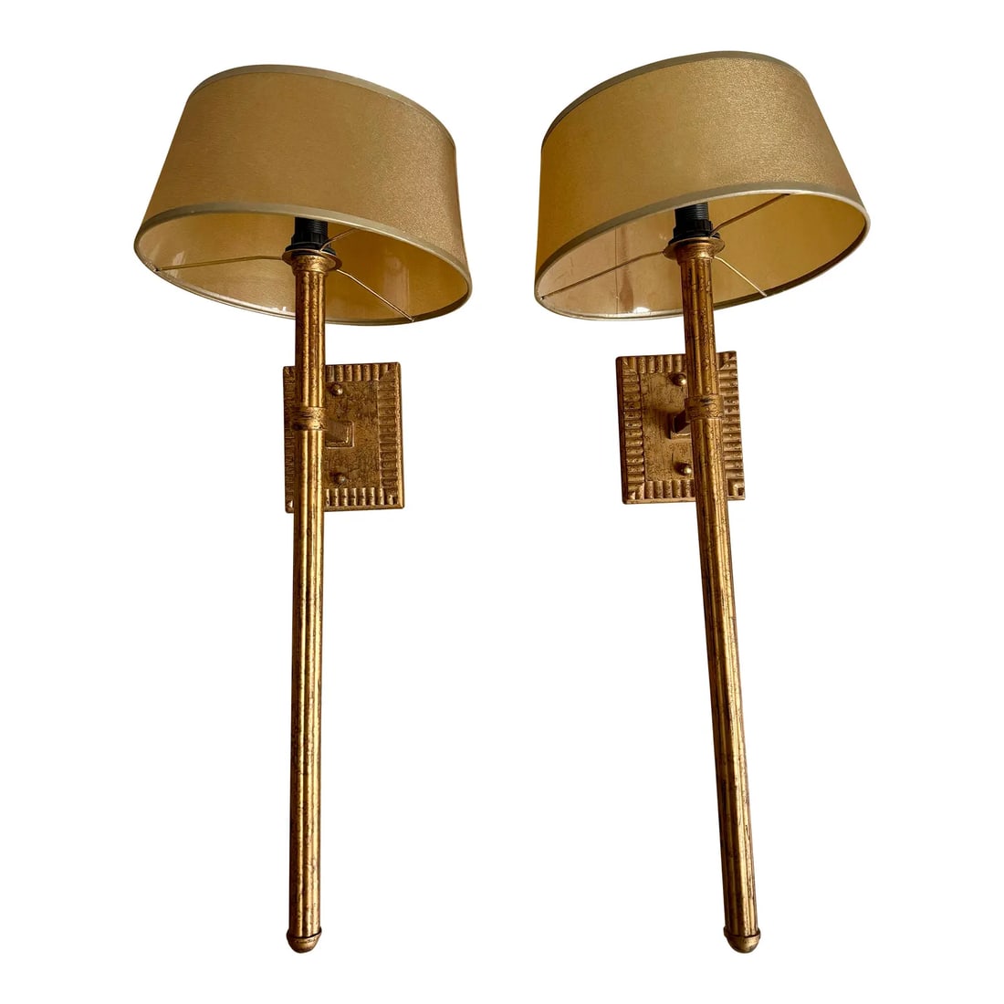 1990s Fine Art Lamps Gold Leaf Torchère Sconces - A Pair: A stunning pair of vintage torchère-style wall sconces by the renowned Fine Art Lamps (now Fine Art Handcrafted Lighting). These elegant fixtures feature a dramatic, elongated fluted stem and a c
