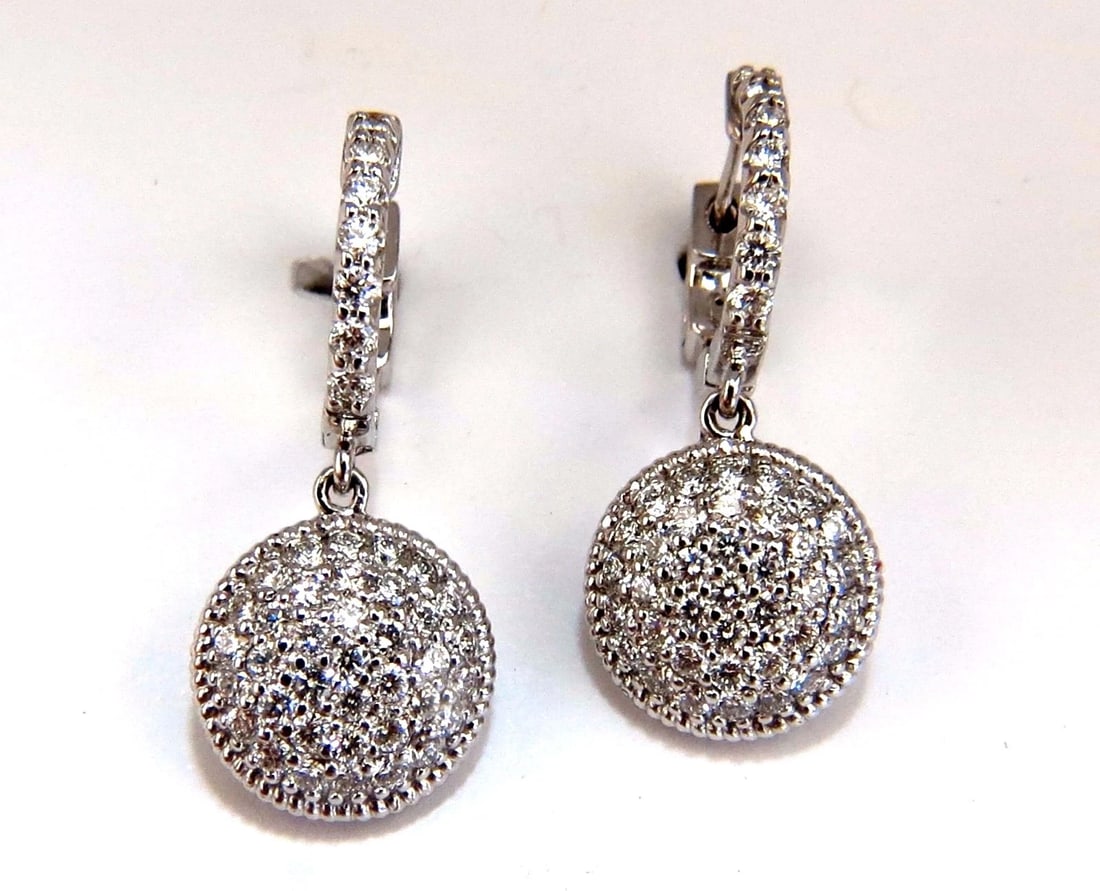 1.10ct natural diamonds dangle earrings 14kt circle dangles**: Title: 1.10ct natural diamonds dangle earrings 14kt circle dangles** Description: Circular diamond dangle earrings. 1.10cts of natural round diamonds: G-color, Vs-2 clarity. 14kt. white gold 5.3 grams