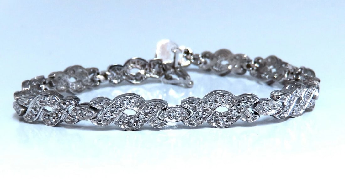 .60ct. natural round diamonds tennis bracelet classic 14 karat white gold**: Title: .60ct. natural round diamonds tennis bracelet classic 14 karat white gold** Description: Ladies natural Diamond classic tennis bracelet. Weave design. .60ct Diamonds: H color, vs2 clarity. 14