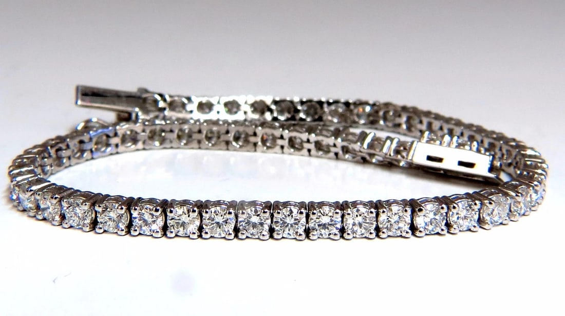 5.18ct Natural diamonds Tennis Bracelet 14kt G/Vs 7 inch 54 count**: Title: 5.18ct Natural diamonds Tennis Bracelet 14kt G/Vs 7 inch 54 count** Description: MAGNIFICENT JEWELS 5.18ct. Natural diamonds tennis bracelet. Full cuts & round brilliants G-color, Vs-2 clarity
