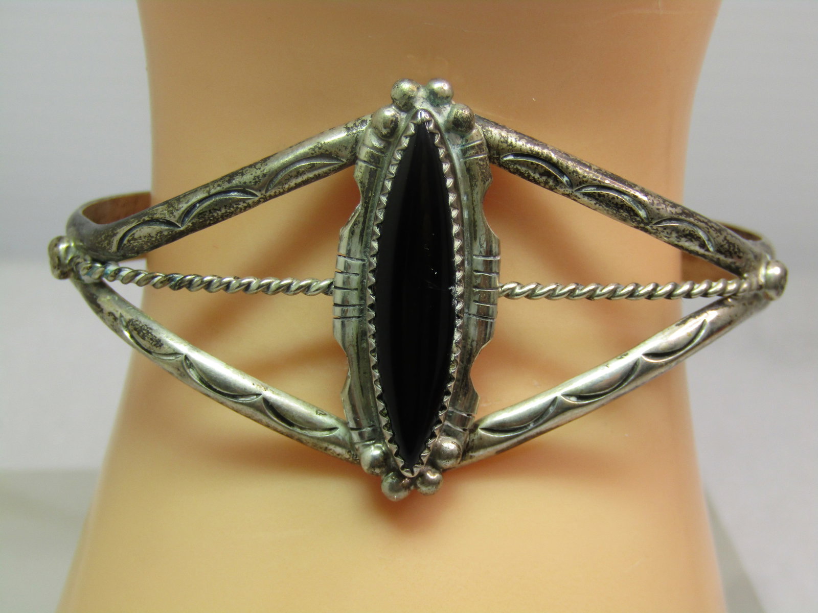 Vintage Sterling Southwestern/Navajo Onyx Cuff Bracelet, 6.5", 1970's-1980's, Signed: Vintage Sterling Southwestern/Navajo Onyx Cuff Bracelet, 6.5", 1970's-1980's, Signed. The onyx is long and pointed and appx. 30mm doing down the wrist and 8mm across with sawtooth bezel-setting