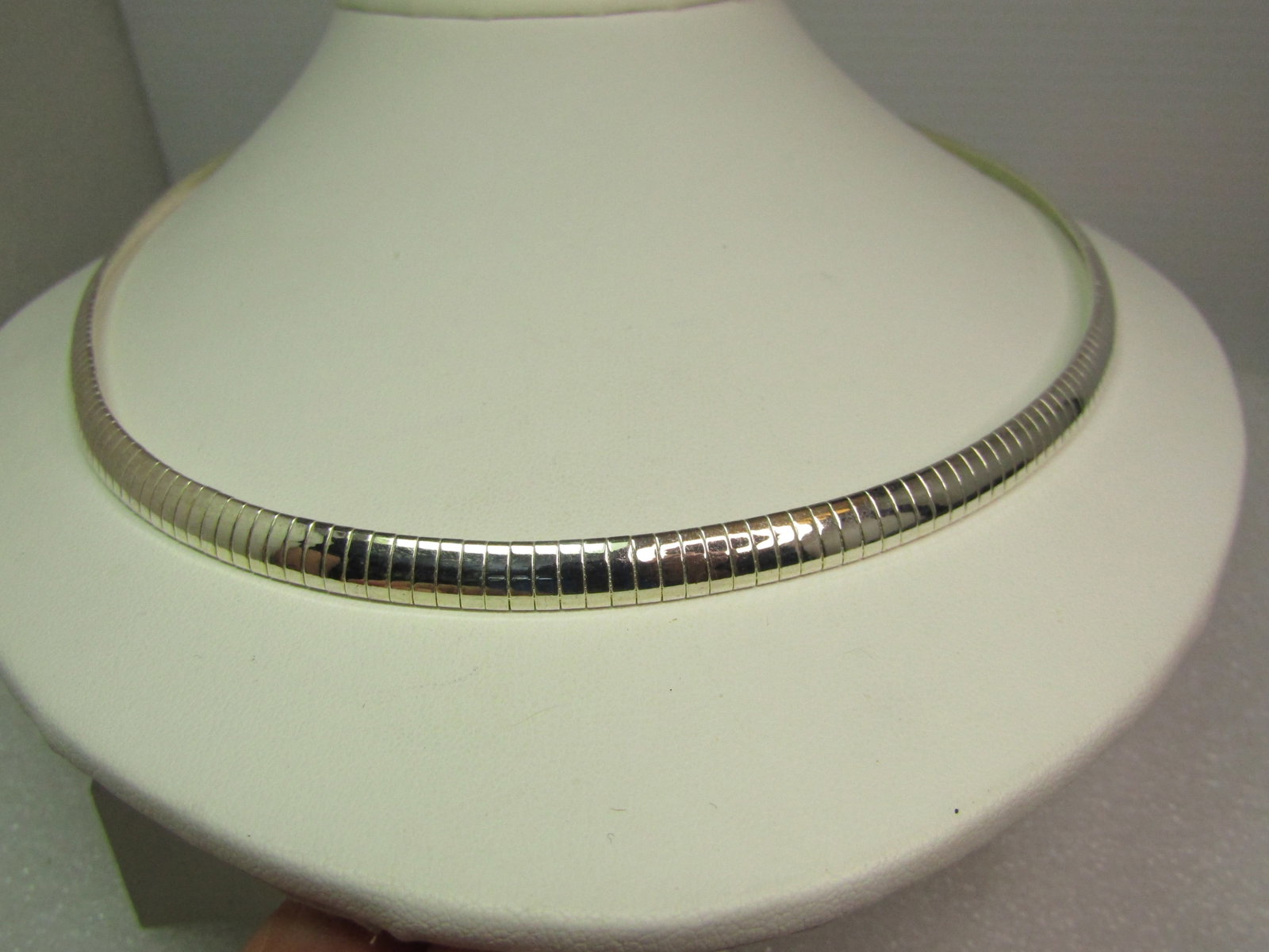 Vintage Silver Tone Omega Necklace, 20", 1980's-1990's: Vintage Silver Tone Omega Necklace, 20", 1980's-1990's. Very clean and bright 5.5mm wide omega link necklace with flip clasp. It is not marked or signed. Excellent conditon - great to wear as is or wi
