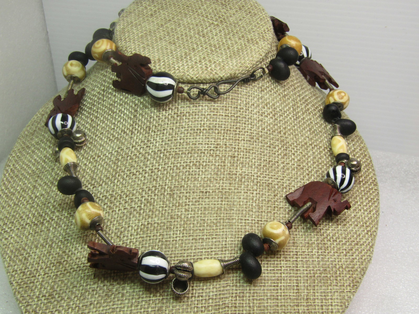 Vintage Wooden Carved Elephant & Glass Beaded Necklace, 28",: Vintage Wooden Carved Elephant & Glass Beaded Necklace, 28", Other beads too. Age is appx. 1970's-1980's Also Bali-style accents. Tribal or cultural themed Necklace. The elphants are appx. 3/4" tall a