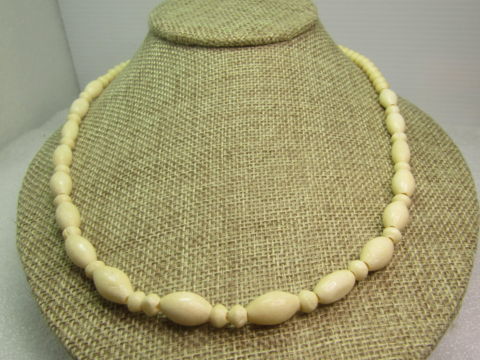Vintage Bone Beaded Necklace, 20", 1970's-1980's: Vintage Bone Beaded Necklace, 20", 1970's-1980's. The beads are rounded with an edge at center and some markings - they are not all exact - appx. 5mm wide with oblong beads that are appx. 6.5mm wide.