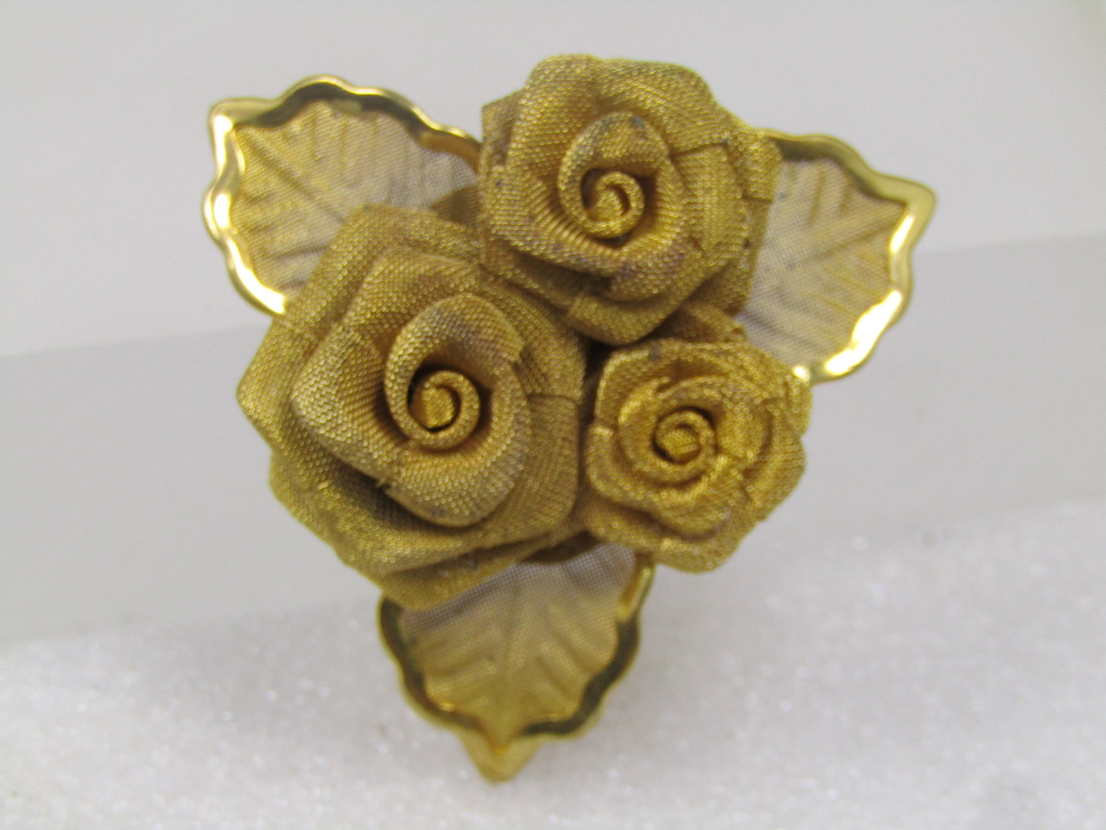 Vintage Triple Mesh Rose Brooch with Leaves, 1970's: Vintage Triple Mesh Rose Brooch with Leaves, 1970's. This is appx. 1-7/8". There are three mesh roses set raised on the mesh leaves - they are graduated in side. The leaves have a mesh finish as well