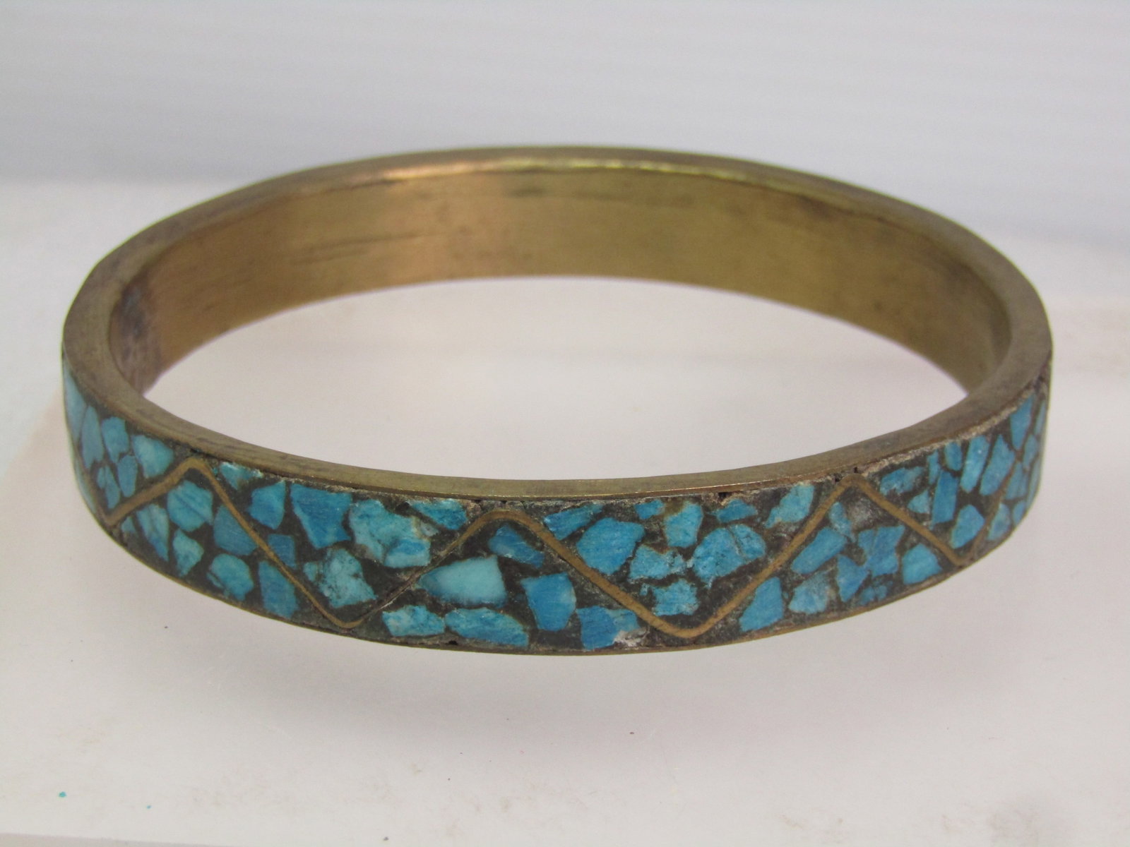 Vintage Brass & Inlaid Turquoise Chip Bangle Bracelet, 8.75, Unisex, 1960's: Vintage Brass & Inlaid Turquoise Chip Bangle Bracelet, 8.75, Unisex, 1960's. This is appx. 1/2" wide. Arrustic piece with a black background and the turquoise stone chips set in and then smoothed. It