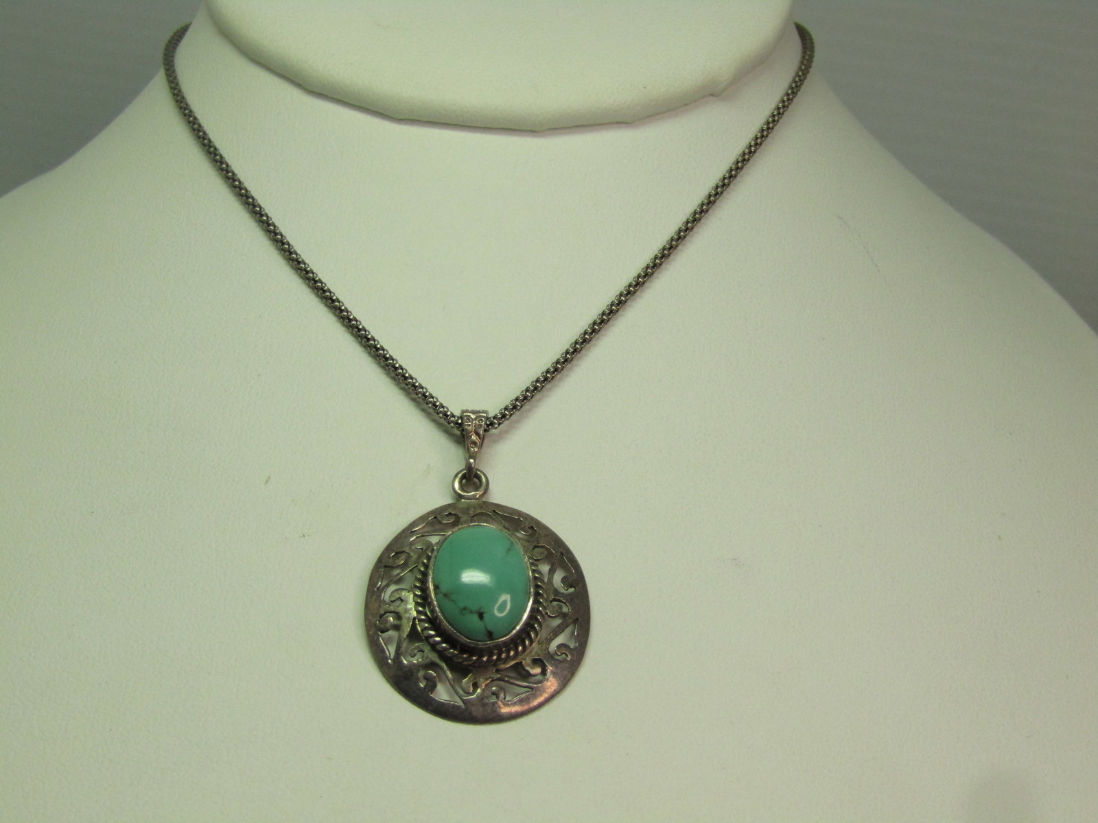 Vintage Sterling Turquoise Scrolled Pendant Necklace, 18" , 1980's-1990's: Vintage Sterling Turquoise Scrolled Pendant Necklace, 18" , 1980's-1990's. The pendant and chain are marked sterling and test as sterling, with an appx. weight of 7.03 grams. The pendant is appx. 1.5"
