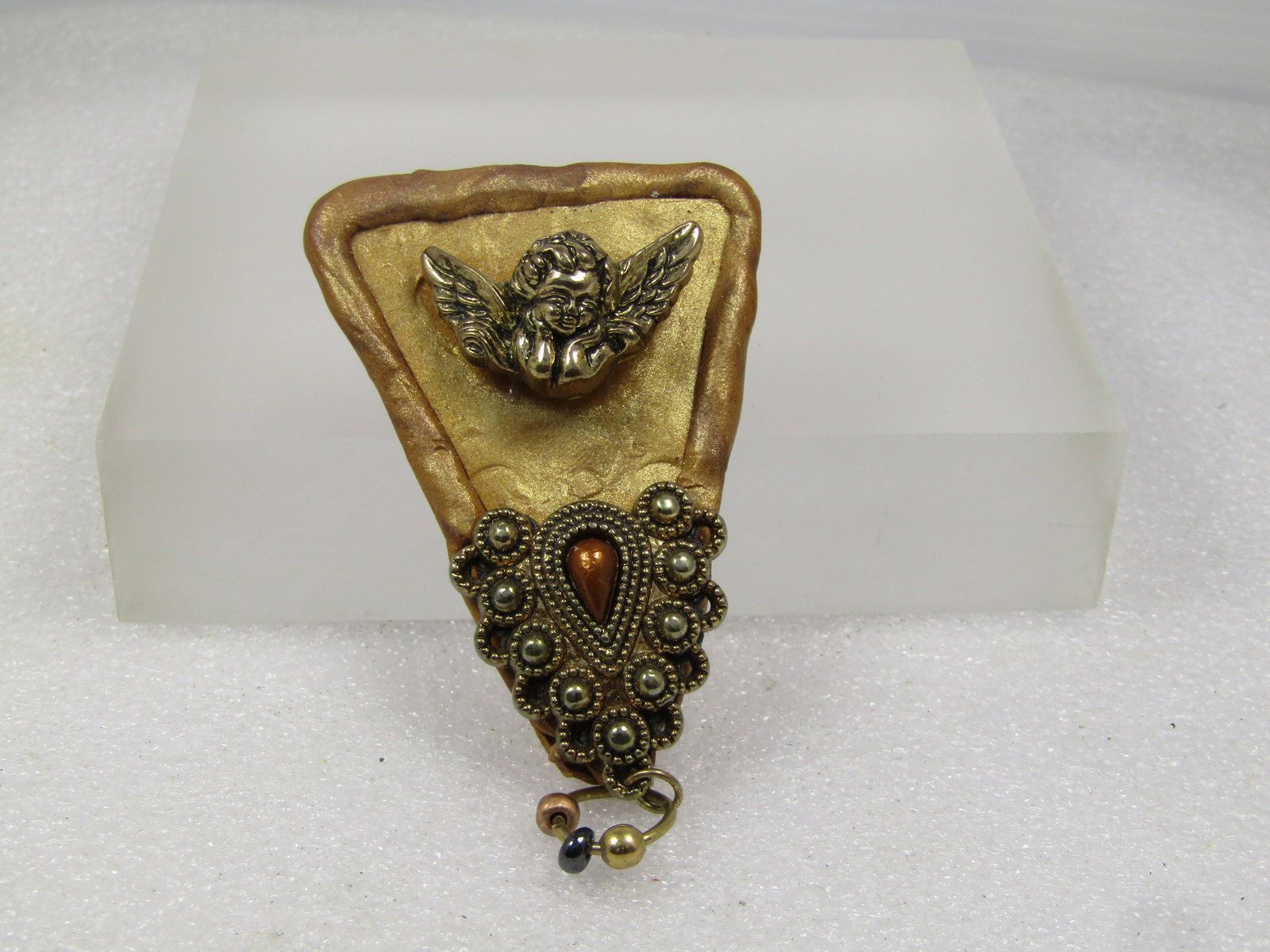 Vintage Cherub Handmade Brooch, Wedge with Embellishments, 1980's: Vintage Cherub Handmade Brooch, Wedge with Embellishments, 1980's. This is made - in a way - in the shape of a pizza slize with a gold tone molded base and a gold tone cherub set ont he top with a