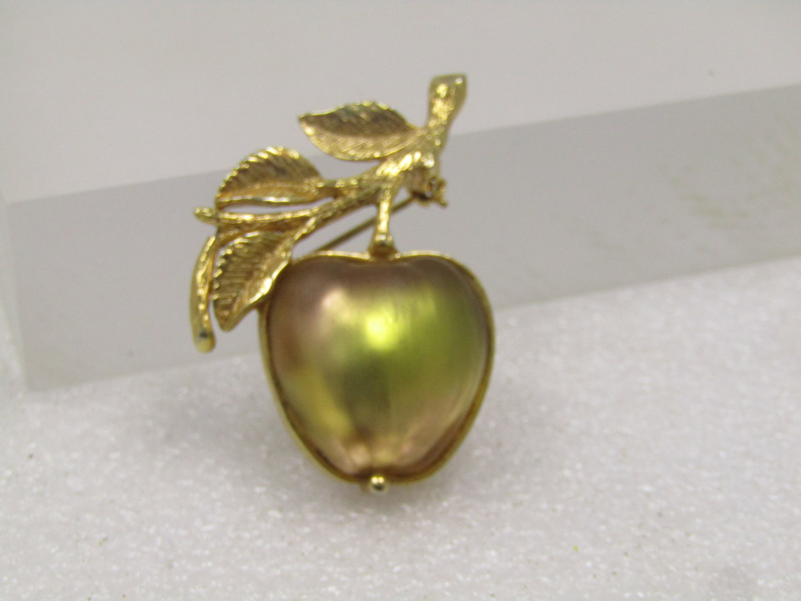 Vintage Sarah Coventry Frosted Glass Apple Brooch, 1960's-1970's: Vintage Sarah Coventry Frosted Glass Apple Brooch, 1960's-1970's. This has a yellow frosted style glass that looks somewhat orange on the edges and green in the stone as well as the yellow - depending