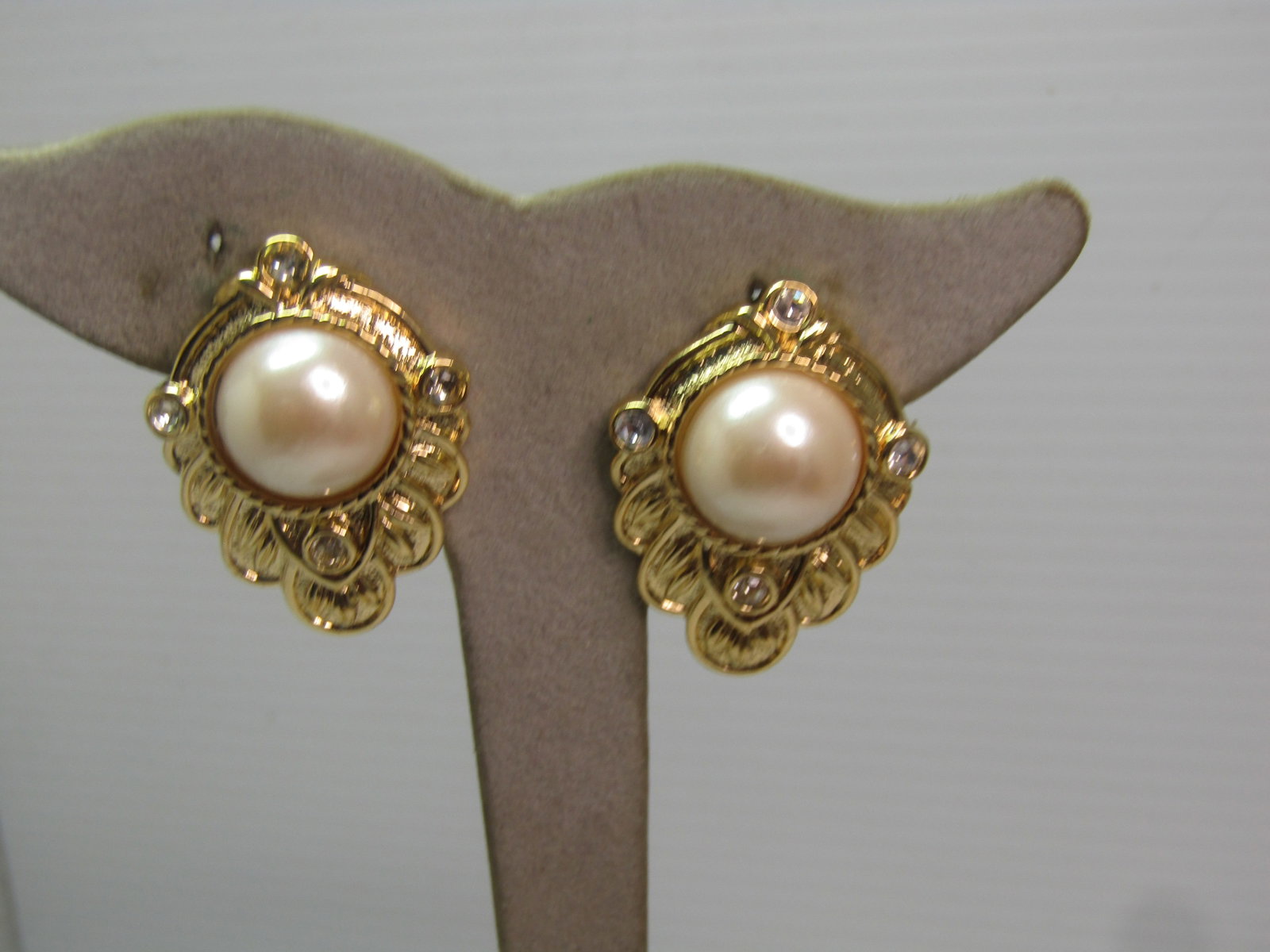 Faux Pearl Renaissance Pearl Earrings, Clip, Jay Kenneth Lane for Avon, 1980's-2000's: Faux Pearl Renaissance Pearl Earrings, Clip, Jay Kenneth Lane for Avon, 1980's-2000's. These are gold tone with clear rhienstones and a center faux pearl half-round nearly 13mm faux pearl. The earring