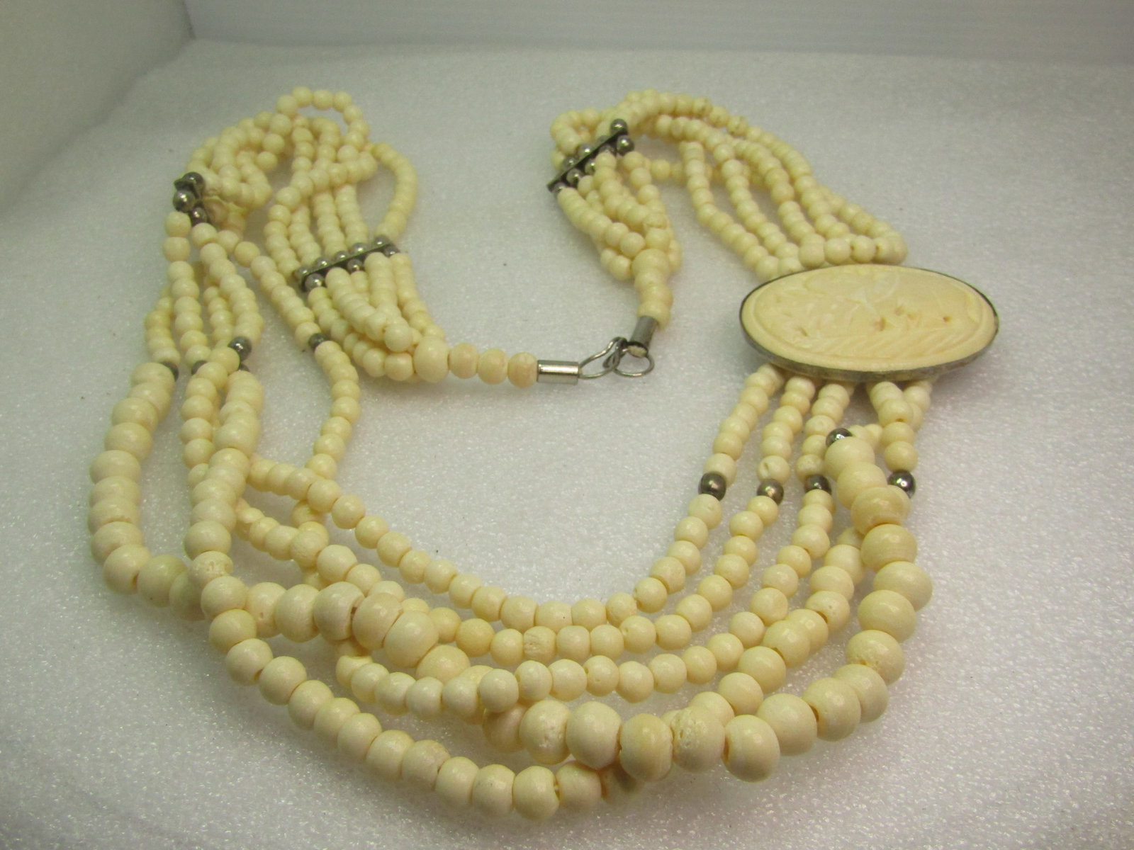 Vintage Carved Bone/Beaded Elephant Necklace, 28", 1970's-1980's: Vintage Carved Bone/Beaded Elephant Necklace, 28", 1970's-1980's. Graduated beads from 4.5mm to 8.5mm with silver tone beads mixed in as well. There is an oval carved elephant is appx. 2" wide and 1.5