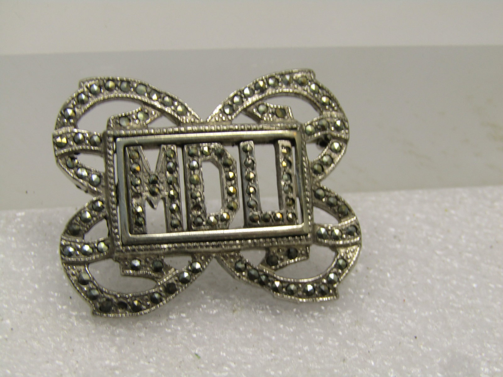 Vintage Marcasite Monogrammed MDU Deco Brooch, 1940's-1950's: Vintage Marcasite Monogrammed MDU Art Deco Brooch, 1940's-1950's. Signed VI. It is appx. 1.5" wide and 1.25" tall. Missing a marcasite which has been replace. It is silver tone and in very good