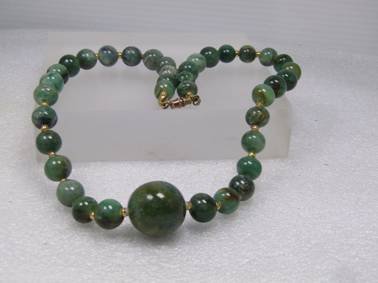 Vintage Green Agate Beaded Necklace, 10.5mm and 18mm Beads, 18", 1970's-1980's: Vintage Green Agate Beaded Necklace, 18" with 10.5mm and 18mm Beads, 18", 1970's-1980's. There are gold tone spacer beads that are a white bead with gold over the bead and some of the gold is worn und