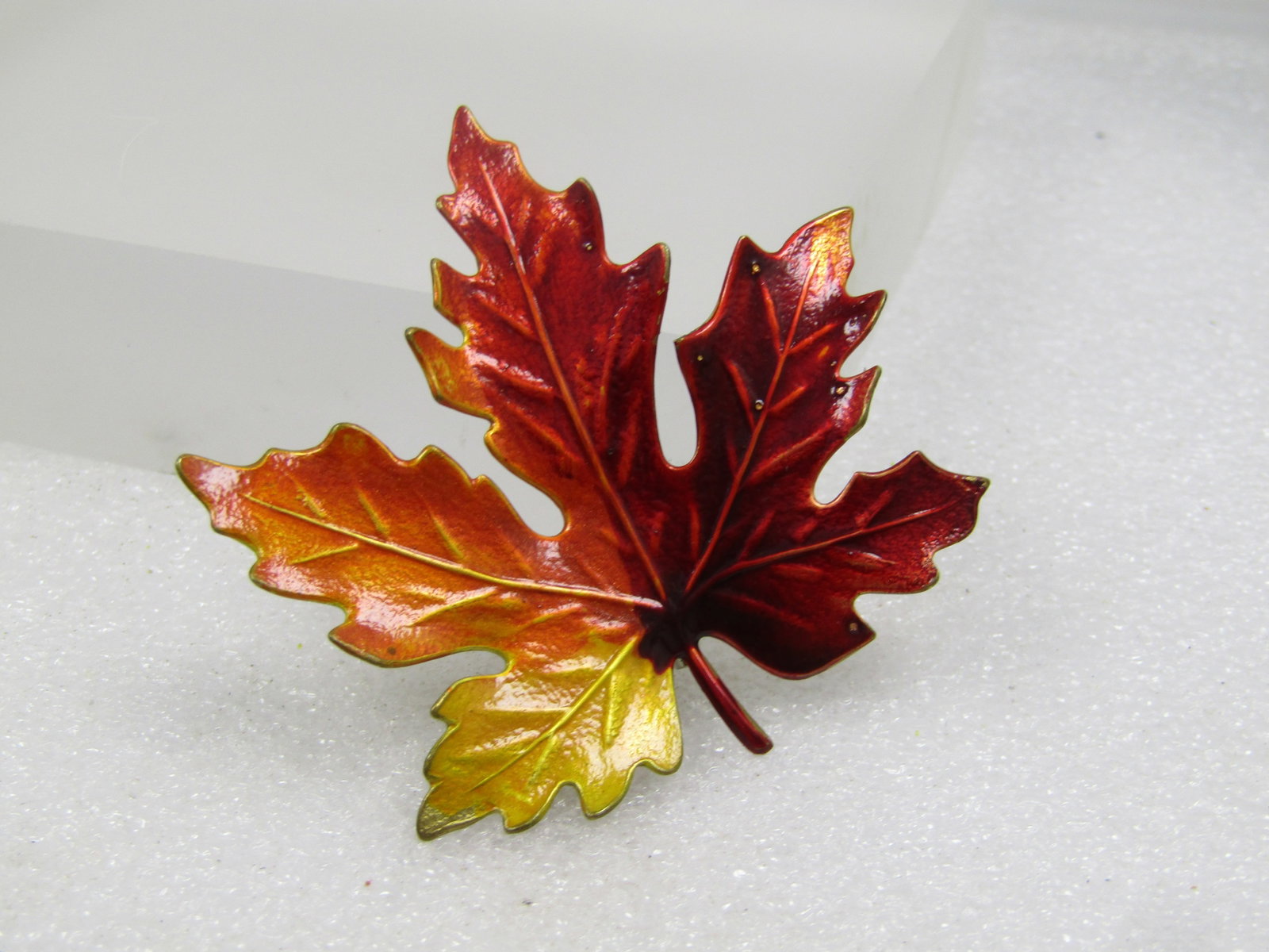 Vintage Enameled Leaf Brooch, Red/Orange/Yellow Maple Leaf, 1960's-1970's: Vintage Enameled Leaf Brooch, Red/Orange/Yellow Maple Leaf, 1960's-1970's. Gold tone back and very nicely detial leaf on front with a mix of yellow orange into lighter than darker red. It is appx. 2.2