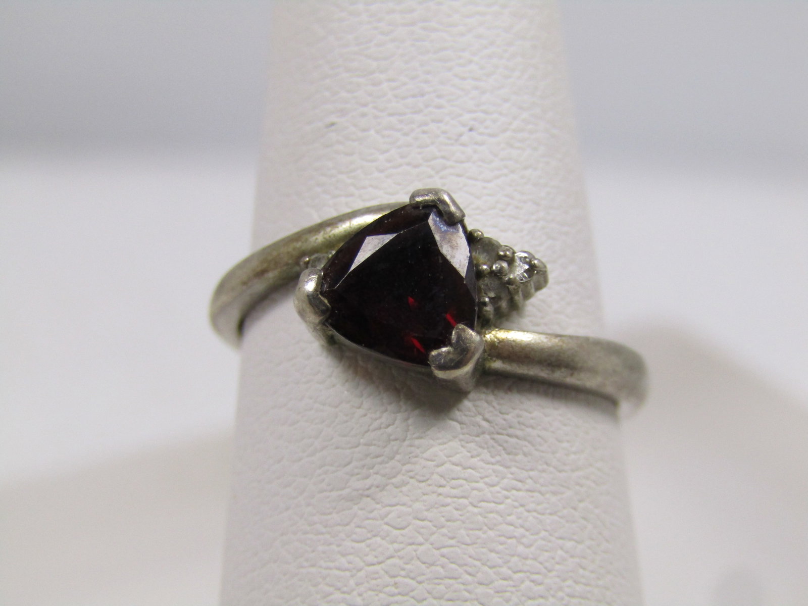 Vintage Sterling Garnet Diamond Ring, Sz. 7.25, 1980's: Vintage Sterling Garnet & Diamond Ring, SZ 7.25, 1980's. This has a triangular cut with prongs - it has faceted edges and is appx. 6mm down each side. Sitting slightly lower off to the side are three 