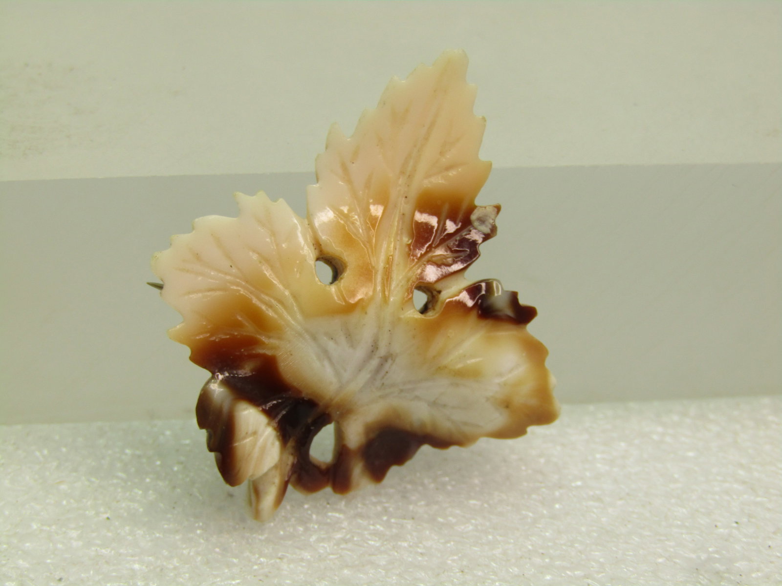 Vintage Brown/White Carved Leaf Brooch, C-Clasp, early 1900's: Vintage Brown/White Carved Leaf Brooch, C-Clasp, early 1900's. This has a shell-like look but I believe it is glass - uncertain. Maple leaf design that is appx. 1-5/8" tall and 1.5" wide. It has a hin