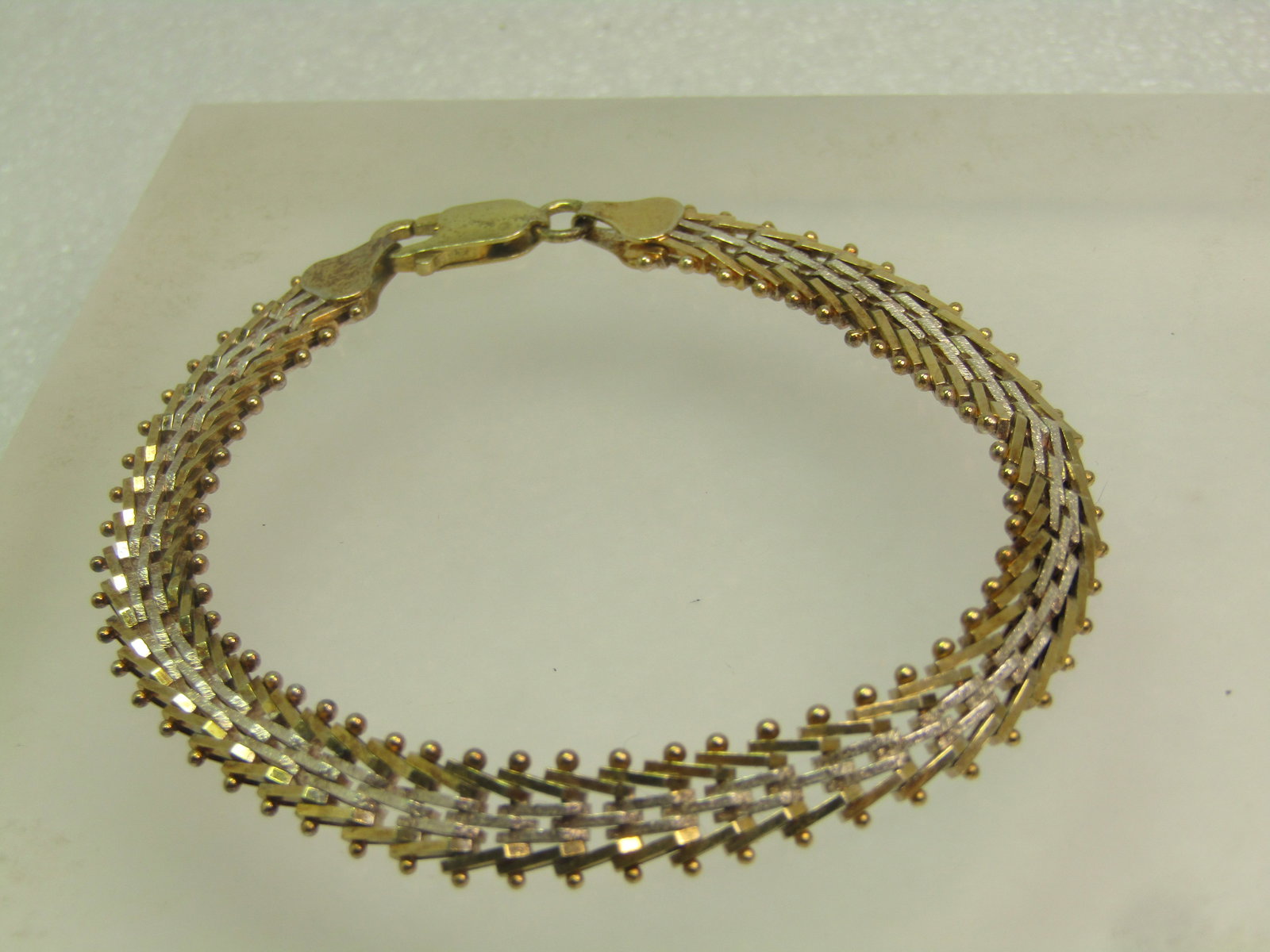 Vintage Sterling Vermeil Woven Bracelet, 8", 1980's-1990's, Two-Tone: Vintage Sterling Vermeil Woven Bracelet, 8", 1980's-1990's, Two-Tone. It is appx. 8mm wide. This is silver and gold tone - one side is all silver tone and the end pieces and clasp are gold over sterli