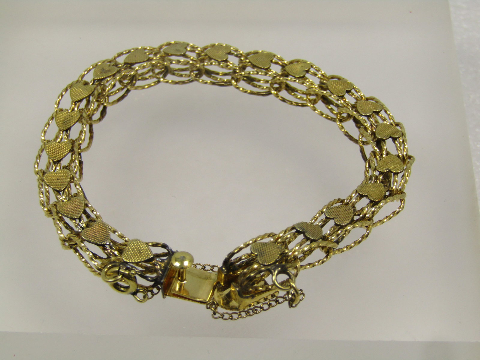 Vintage 12kt G.F. Heart Link Bracelet, 7.5", 8mm wide, 1960's-1970's: Vintage 12kt G.F. Heart Link Bracelet, 7.5", 8mm wide, 1960's-1970's. Great as a bracelet or a charm bracelet too. This has a safety chain with a spring ring clasp so it is easy to disconnect to slide