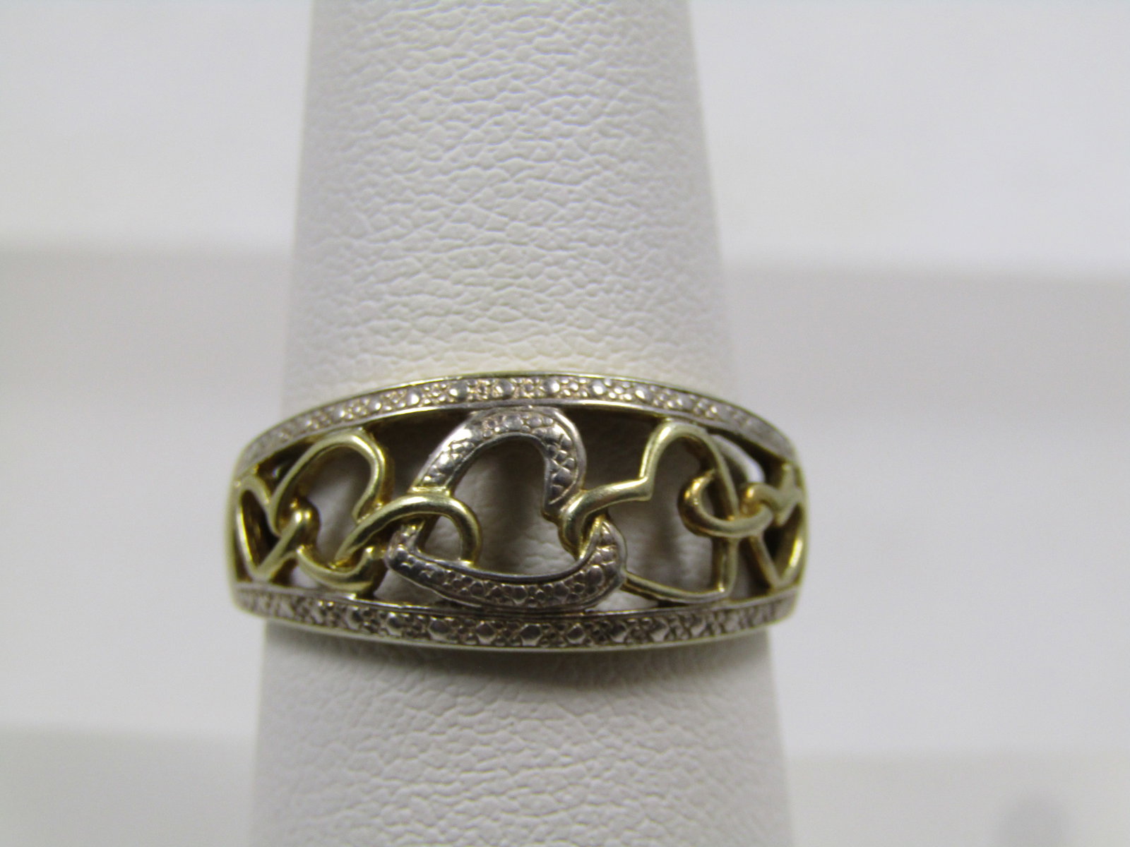 Vintage Sterling Heart Trail Ring, Sz. 8.25, Israel 1980's-1990's: Vintage Sterling Heart Trail Ring, Sz. 8.25, Israel 1980's-1990's. Tests as silver with a weight of appx. of 2.81 grams. Two-tone with yellow gold vermiel in most of the band and some of the hearts