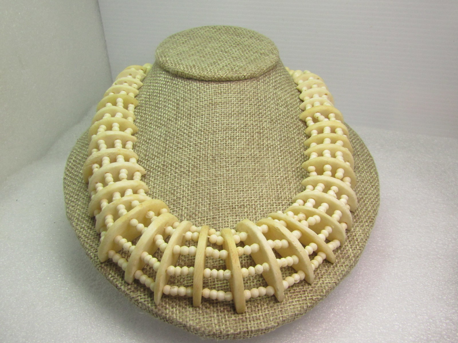 Vintage Carved & Beaded Bone Necklace, Five Strands, 19", 1980's, Tribal: Vintage Carved & Beaded Bone Necklace, Five Strands, 19", 1970's-80's. T his has a tapered design with five strands of off white bone beads and half circle carved dividers that are graduated in size t