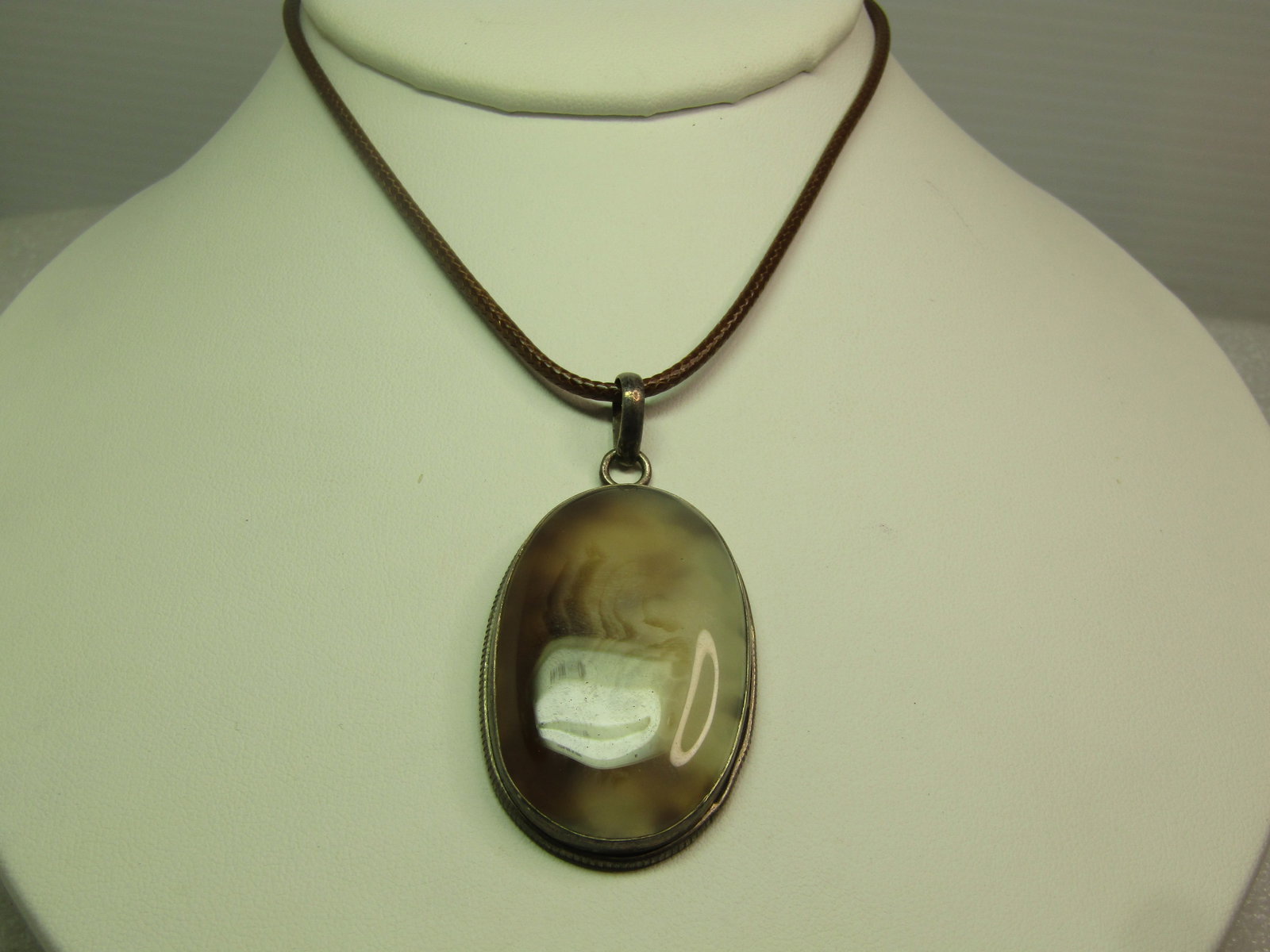 Vintage Sterling Brown/White Agate Pendant, on Brown Cord Necklace, 18"-20", 1970's-1980's,: Vintage Sterling Brown/White Agate Pendant, on Brown Cord Necklace, 18"-20", 1970's-1980's, Southwestern Themed. The pendant has a bezel-set brown/transulcent dentritic agate that has an almost design