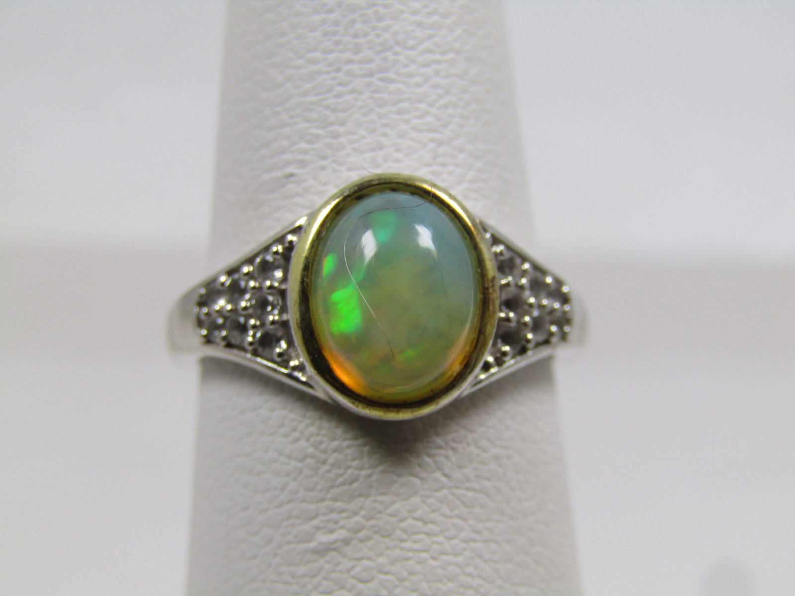 Sterling Created Opal and Topaz Ring, Sz. 6, Signed KHR, 2000's: Sterling Created Opal and Topaz Ring, Sz. 6, 2000's, Signed KHR and marked .925 and India. It tests as sterling with an appx. weight of 3.21 grams. The opal is set in a bezel frame and is papx. 8.5mm 