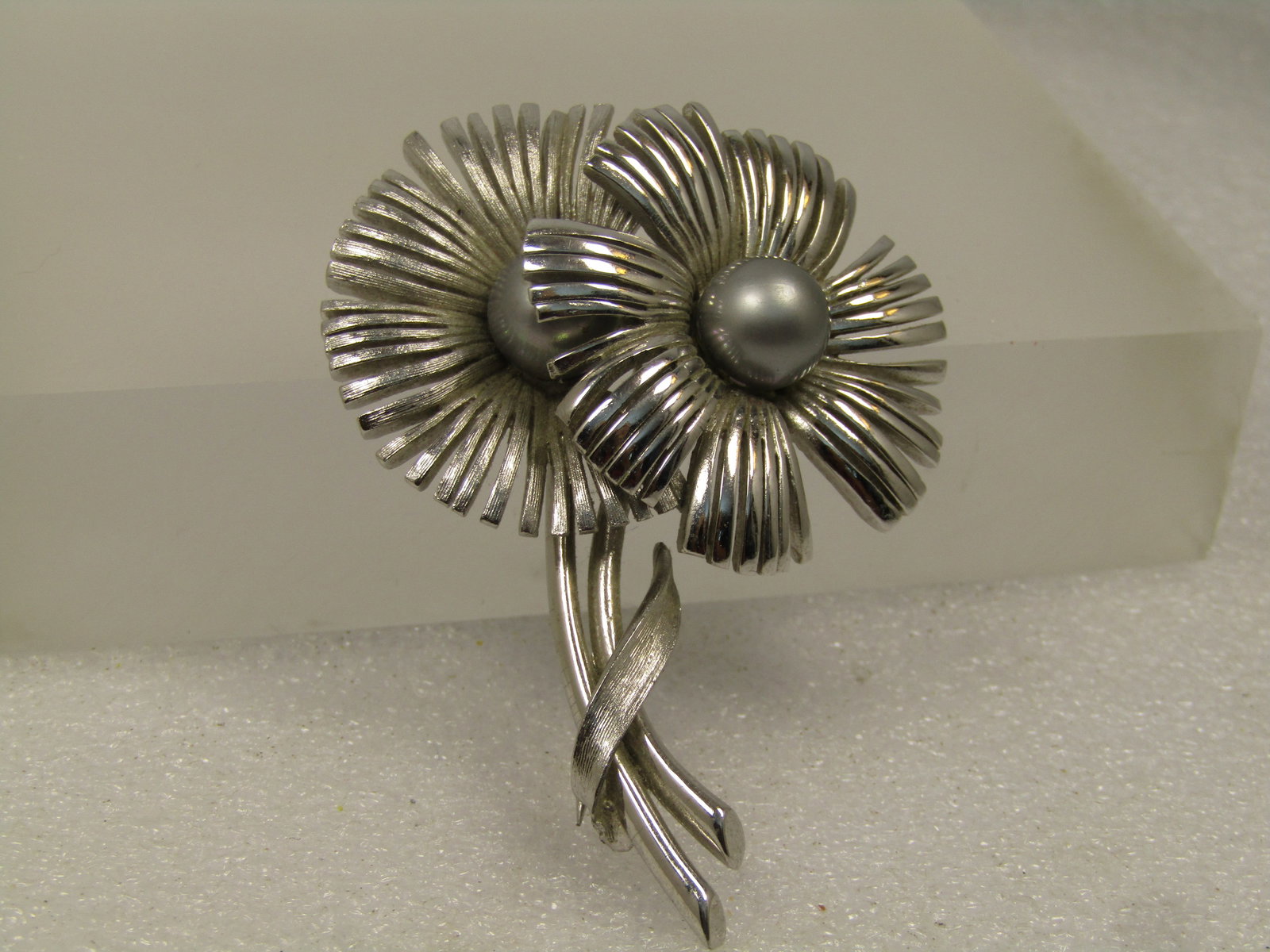 Vintage Double Blossom & Faux Pearl Brooch, 1960's: Vintage Double Blossom & Faux Pearl Brooch, 1960's. This has a shiny and matte finish on the sterling with a center silvery faux pearl in each flower. The petals are a mod design with long connected