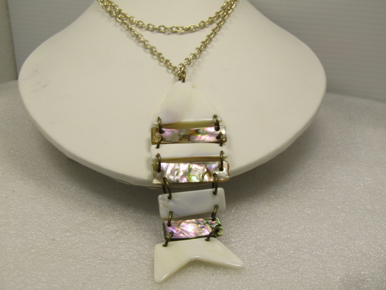 Vintage Mother-of-Pearl Articulated Fish Necklace, 26", 1960's-1970's.: Vintage Mother-of-Pearl Articulated Fish Necklace, 26", 1960's-1970's. The fish is appx. 3.5" long and 1.25" wide. The chain is a silver tone textured link that is appx. 3.5mm wide with a spring ring
