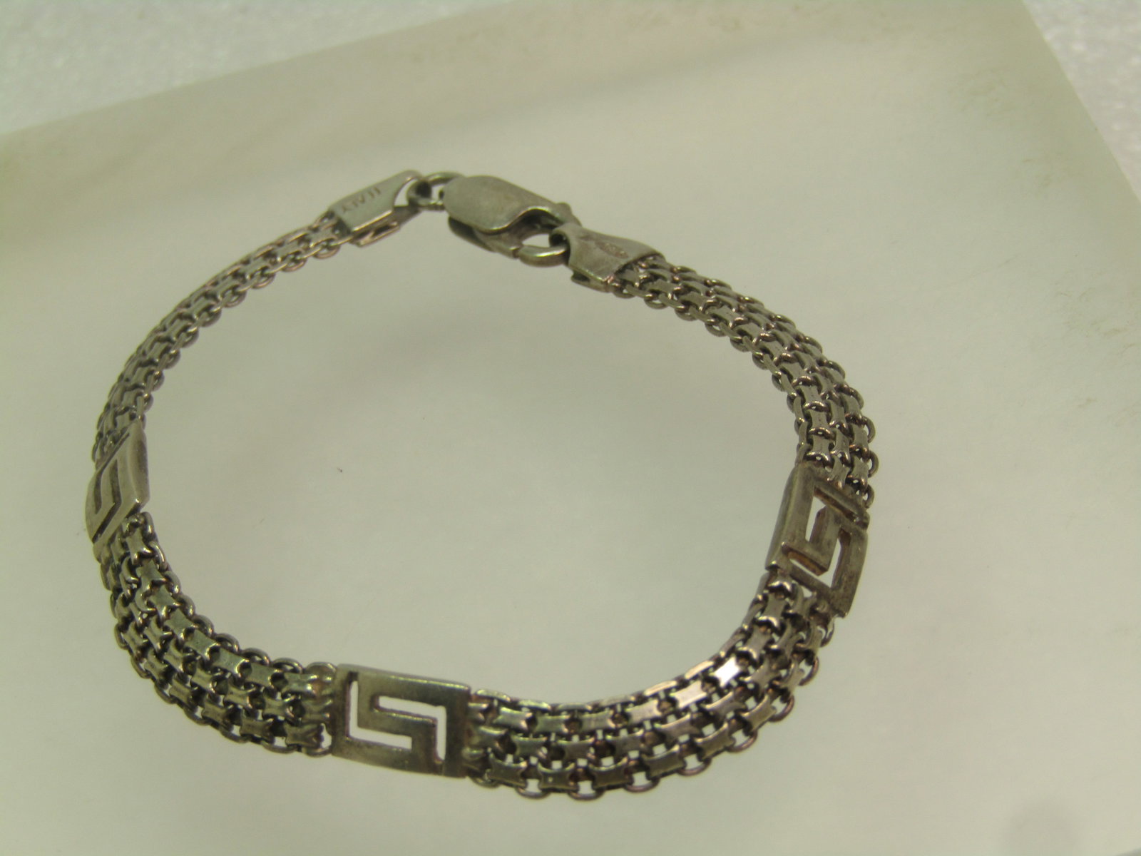 Vintage Sterling Woven Greek Key Bracelet, 7", 1980's-1990's: Vintage Sterling Woven Greek Key Bracelet, 7", 1980's-1990's. This has three Greek Key links between three mesh/woven rows. Lobster clasp . This is appx. 6mm wide. It is marked Italy and .925 and test