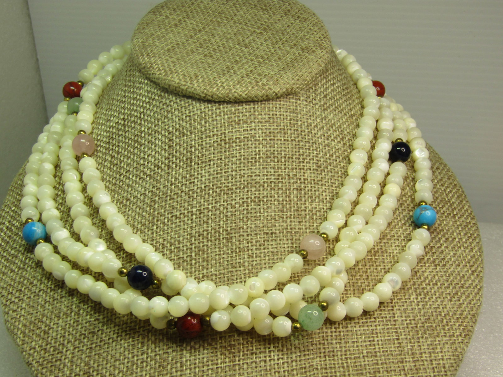 Vintage Mother-of-Pearl Beaded Necklace with Onyx, Jasper, Quartz and Jade, 70". 1980's-1990's: Vintage Mother-of-Pearl Beaded Necklace with Onyx, Jasper, Quartz and Jade, 70". 1980's-1990's. The mother-of-pearl beads are appx. 6mm with eighteen in a section and then a gold tone bead and either 