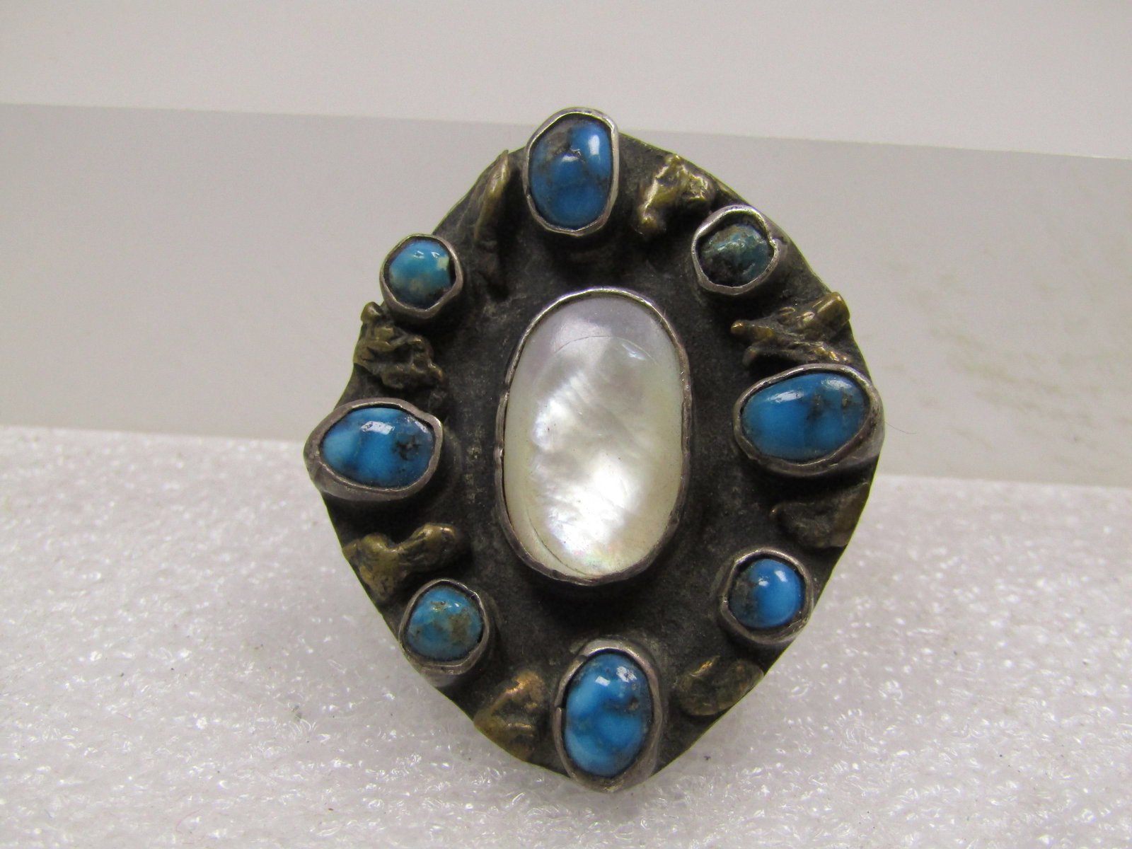 Vintage Sterling Southwestern MOP Turquoise Pendant, 1950's-1960's: Vintage Sterling Southwestern MOP Turquoise Pendant, 1950's-1960's. These stones are set raised on the sterling background with brass nugget accents between each of the turquoise stones which are